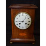 AN EDWARDIAN MAHOGANY MANTEL CLOCK. 26 cm x 15 cm.