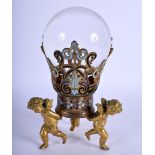 A 19TH CENTURY FRENCH CHAMPLEVE ENAMEL GILT BRONZE CRYSTAL BALL HOLDER formed as three standing putt