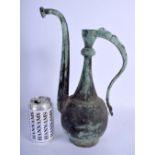 A 19TH CENTURY MIDDLE EASTERN PERSIAN KHOROSAN BRONZE EWER with shaped handle. 34 cm x 14 cm.