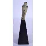 AN EGYPTIAN FAIENCE GLAZED USHABTI. Figure 6.5 cm high.