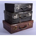 THREE FINE ANTIQUE CROCODILE SKIN SUITCASES. Largest 50 cm x 35 cm. (3)