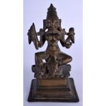 AN 18TH/19TH CENTURY INDIAN BRONZE FIGURE OF A BUDDHISTIC DEITY modelled upon a square form base. 12