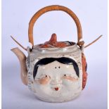 A RARE EARLY 20TH CENTURY JAPANESE MEIJI PERIOD PORCELAIN MASK TEAPOT AND COVER of amusing form. 21