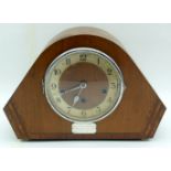 A wooden inlaid mantle clock with a silver dedication plaque 23cm.