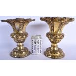 A PAIR OF 18TH/19TH CENTURY CONTINENTAL GILDED METAL VASES decorated with acanthus. 974 grams. 21 cm