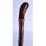 A 19TH CENTURY JAPANESE MEIJI PERIOD CARVED BAMBOO SWORD STICK of naturalistic form. 86 cm long.