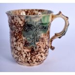 AN 18TH CENTURY WHIELDON TYPE COFFEE CUP painted with an egg and spinach glaze, overlaid with motifs
