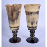 A PAIR OF 19TH CENTURY MIDDLE EASTERN CARVED RHINOCEROS HORN PEDESTAL STEMS with buffalo horn beaker