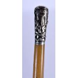 A RARE 19TH CENTURY CHINESE CARVED BLOND RHINOCEROS HORN FULL LENGTH SWAGGER STICK with silver mount
