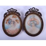 A PAIR OF EARLY 20TH CENTURY CONTINENTAL PAINTED IVORY PORTRAIT MINIATURES. Miniature 9 cm x 7 cm. (