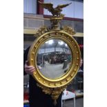 AN ANTIQUE GILTWOOD EAGLE MIRROR. 109 cm x 60 cm.