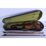 A CASED SINGLE PIECE BACK VIOLIN together with two bows. 59 cm long.