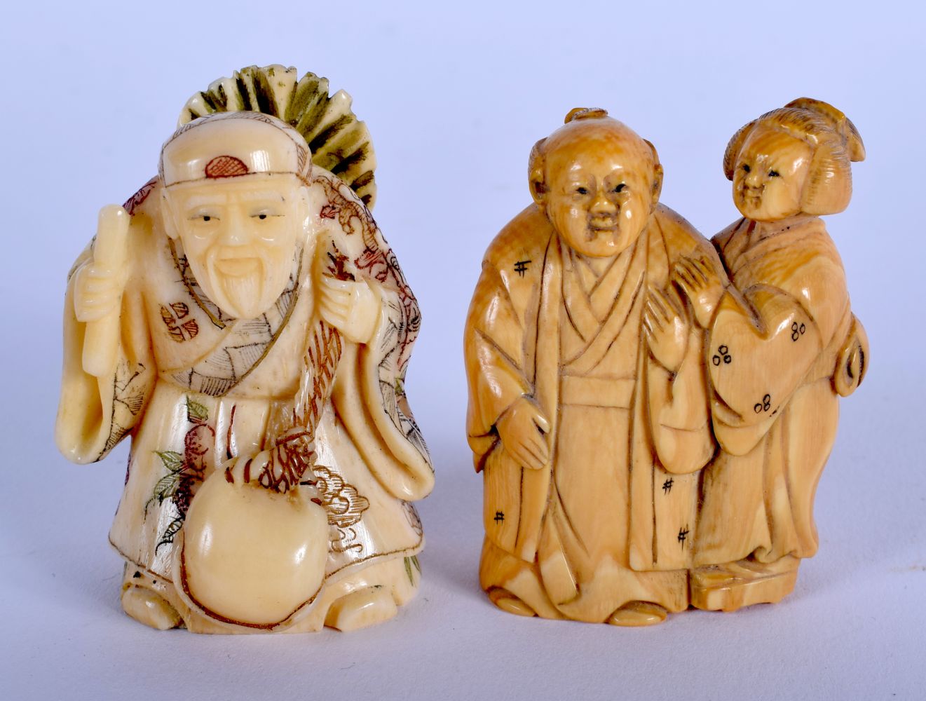 AN EARLY 20TH CENTURY JAPANESE MEIJI PERIOD CARVED IVORY NETSUKE together with another C1920 bone ne