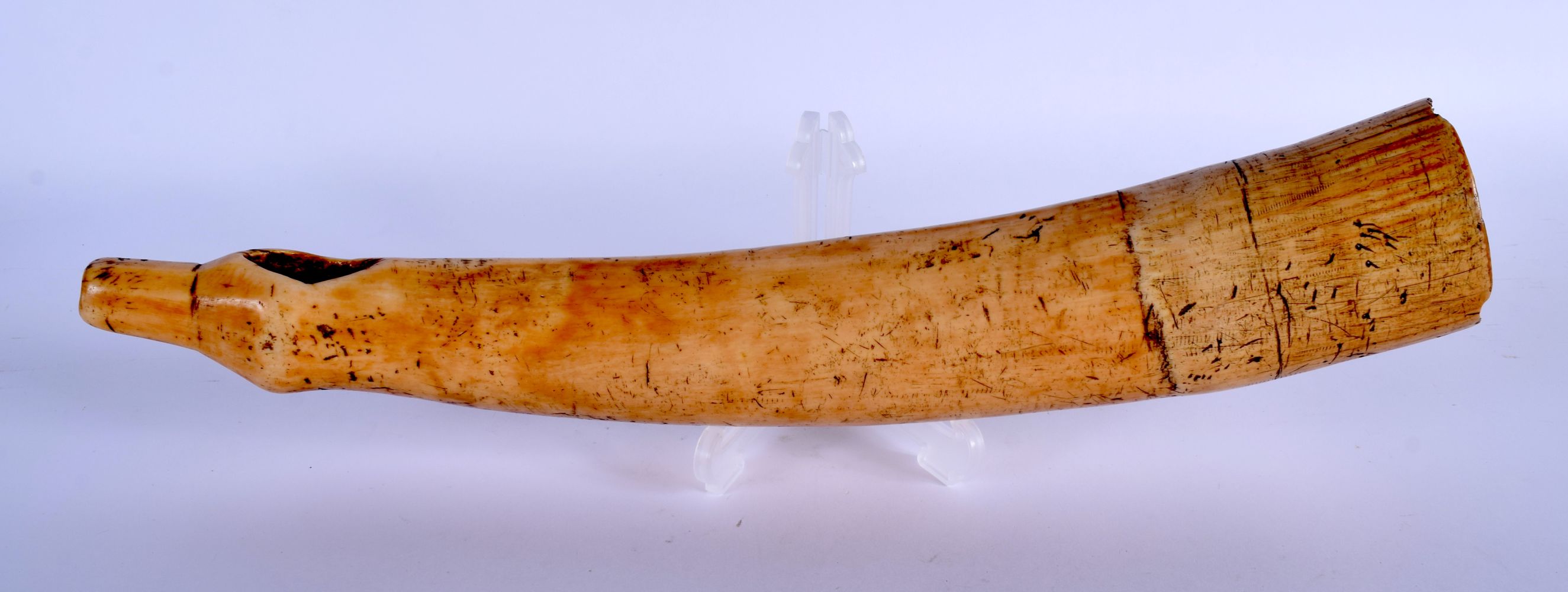 AN 18TH CENTURY CONTINENTAL CARVED IVORY OLIPHANT of plain form and good colour. 41 cm long.