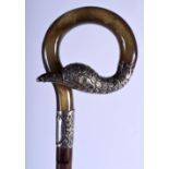 A RARE 19TH CENTURY EUROPEAN SILVER MOUNTED RHINOCEROS HORN PARASOL HANDLE. 25 cm high.