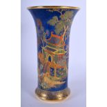 AN ART DECO CARLTON WARE PORCELAIN VASE enamelled with landscapes. 21 cm high.