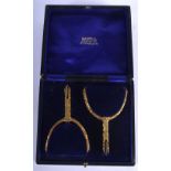 A PAIR OF ANTIQUE SPANISH GILT BRONZE SPURS. 11 cm x 6 cm.