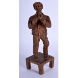 A RARE EARLY 20TH CENTURY IRISH FOLK ART CARVED WOOD BARE KNUCKLE BOXER. 19 cm high.