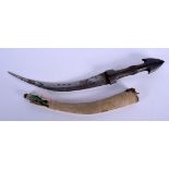 A 19TH CENTURY CONTINENTAL CARVED RHINOCEROS HORN HANDLED KNIFE with curving blade. 36 cm long.