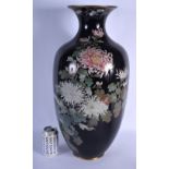 A LARGE 19TH CENTURY JAPANESE MEIJI PERIOD CLOISONNE ENAMEL VASE decorated with bold foliage and vin