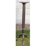 AN ANTIQUE MAHOGANY TORCHERE STAND with claw and ball feet. 135 cm high.