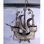 A VERY LARGE 19TH CENTURY CONTINENTAL WHITE METAL SHIP modelled upon fish supports. 80 cm x 55 cm.