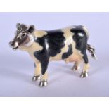 A SILVER AND ENAMEL FIGURE OF A COW. 34 grams. 5 cm x 4 cm.