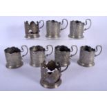 A SET OF ANTIQUE MIDDLE EASTERN PERSIAN SILVER GLASS HOLDERS decorated with figures and animals. 969