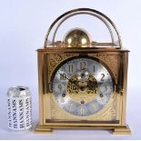 A RARE GERMAN KIENINGER BRASS BELL STRIKING MANTEL CLOCK with silvered dial and brass numerals. 34 c