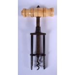 AN ANTIQUE IVORY HANDLED CORK SCREW. 16 cm x 7 cm.