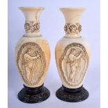 A FINE PAIR OF LATE 18TH/19TH CENTURY EUROPEAN CARVED IVORY VASES formed with classical figures and