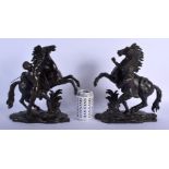 A FINE PAIR OF 18TH CENTURY EUROPEAN BRONZE FIGURES OF MARLEY HORSES modelled upon naturalistic base