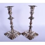 A PAIR OF ANTIQUE OLD SHEFFIELD PLATED CANDLESTICKS. 25 cm high.