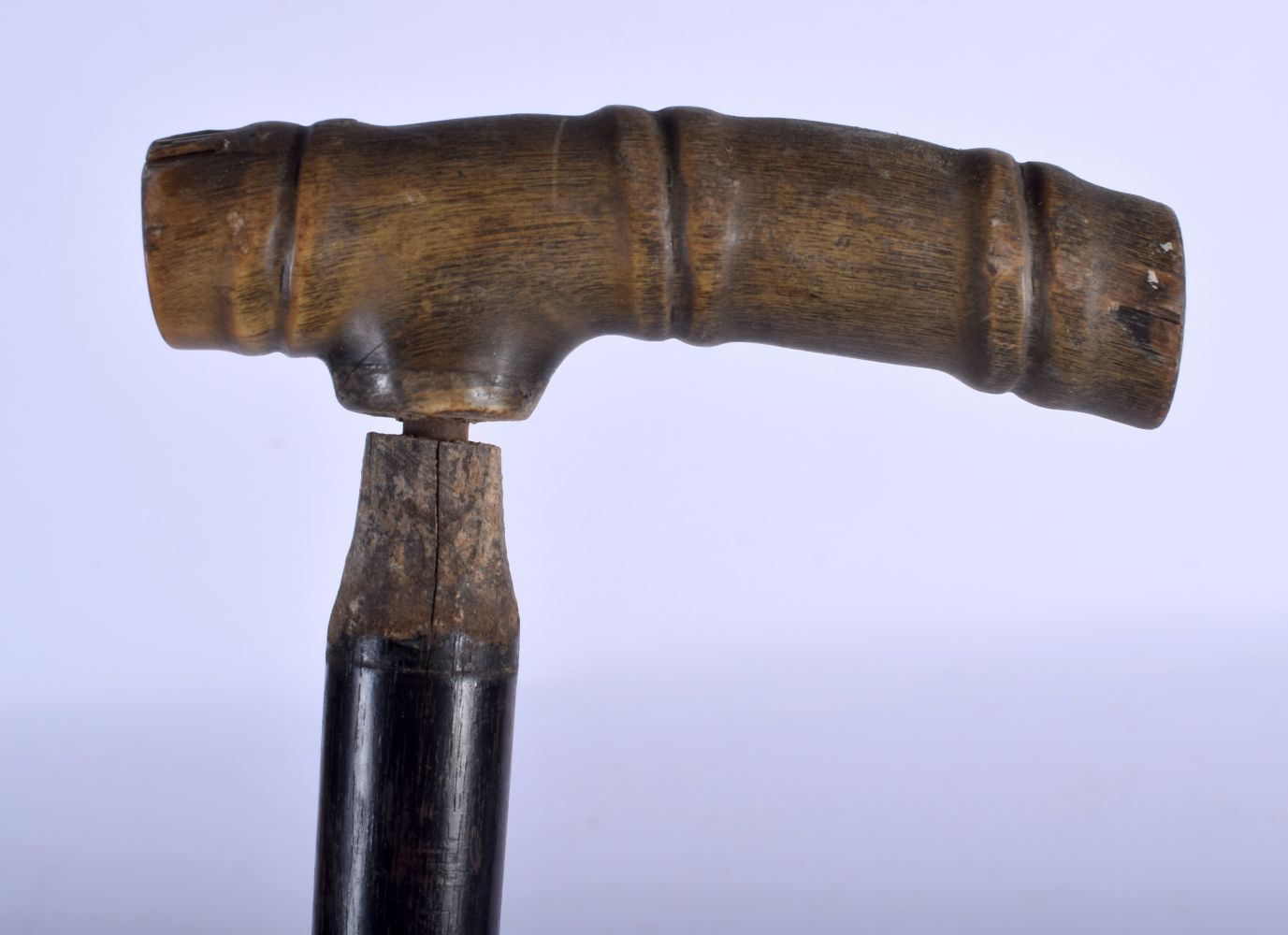 A 19TH CENTURY MIDDLE EASTERN CARVED RHINOCEROS HORN HANDLED WALKING CANE. 88 cm long.