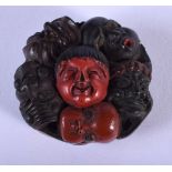 A VERY UNUSUAL 19TH CENTURY JAPANESE MEIJI PERIOD MULTI MASK HEAD NETSUKE C1880. 3.75 cm wide.