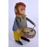 A VINTAGE SCHUCO TIN PLATE AUTOMATON MONKEY. 11 cm high.