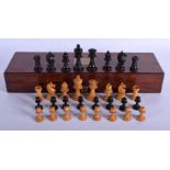 AN ANTIQUE BOXWOOD AND EBONY CHESS SET within an antique box. Box 40 cm wide, largest chess piece 7