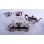AN ANTIQUE OLD SHEFFIELD PLATED DESK STAND together with a plated teaset. Largest 24 cm wide. (4)