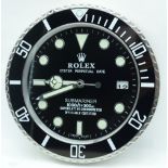 A contemporary Rolex type wall clock 34cm.