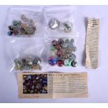 A COLLECTION OF ANTIQUE GLASS MARBLES including large examples, contained within 4 bags. Largest 3.2
