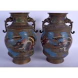 A 19TH CENTURY JAPANESE MEIJI PERIOD TWIN HANDLED BRONZE VASES enamelled with dragons. 27 cm x 13 cm