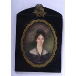 AN ANTIQUE PAINTED IVORY PORTRAIT MINIATURE depicting a female within a black dress. Image 7.5 cm x