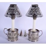 A PAIR OF ANTIQUE SILVER PLATED CHAMBER STICKS with lanterns. 12 cm x 10 cm.