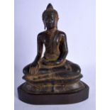 AN 18TH CENTURY SOUTH EAST ASIAN BRONZE FIGURE OF A BUDDHA upon a wooden plinth. Buddha 21 cm x 14 c