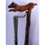 A 19TH CENTURY MIDDLE EASTERN SILVER HANDLED WALKING CANE together with a Bavarian black forest cane