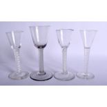 THREE GEORGE III SPIRAL TWIST GLASSES together with an Edwardian glass, three with opaque twists. La