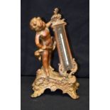 AN ANTIQUE BRONZE CHERUB BAROMETER. 20 cm high.