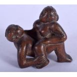 AN UNUSUAL JAPANESE BOXWOOD EROTIC NETSUKE. 3 cm x 3.5 cm.