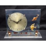 A RARE 1950S LUCITE RETRO FISH CLOCK decorated with fish swimming amongst reeds. 20 cm x 17 cm.