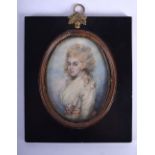 AN EARLY 19TH CENTURY PAINTED IVORY PORTRAIT MINIATURE depicting a female wearing ruffled clothing.